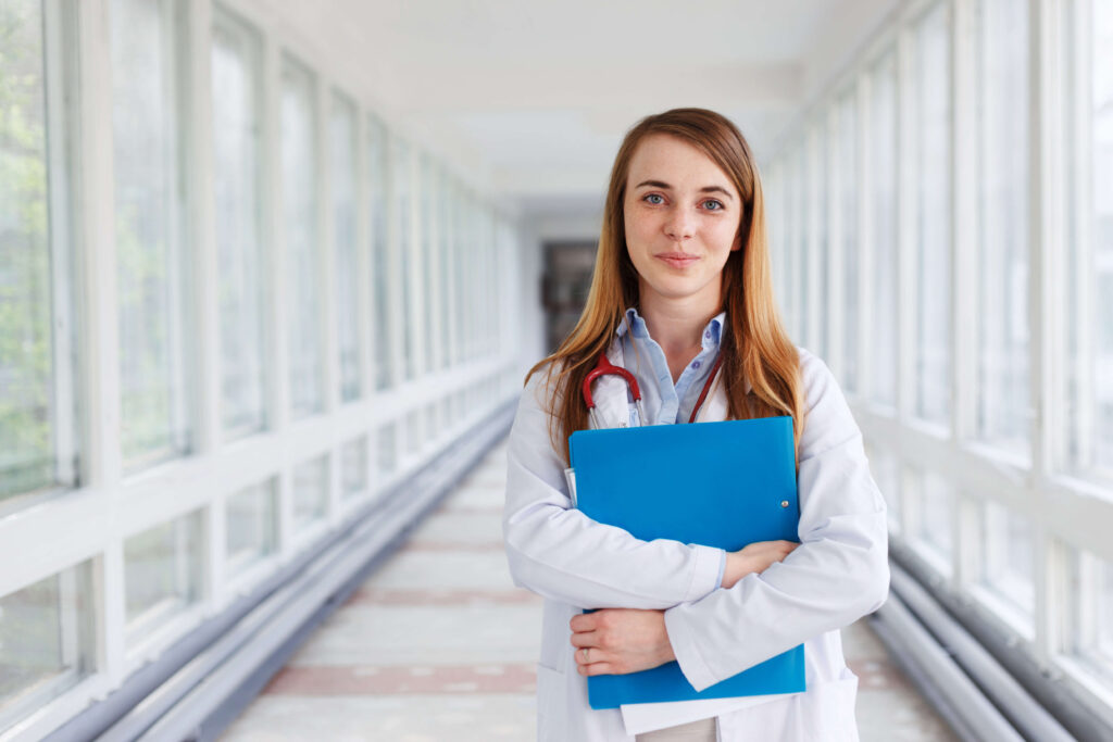 medical doctor woman over clinic interiers backgro 2023 11 27 05 27 48 utc