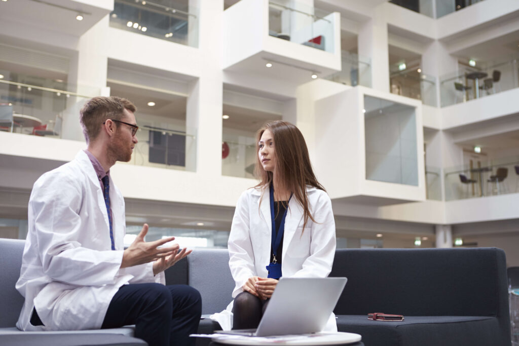 two doctors having meeting in hospital reception a 2024 10 19 08 50 21 utc