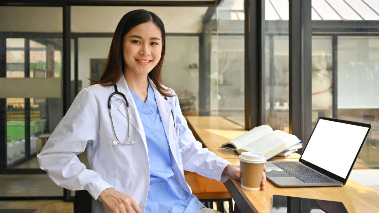 confident asian female doctor in white coat and st 2024 11 29 23 12 01 utc 1920x1080 1
