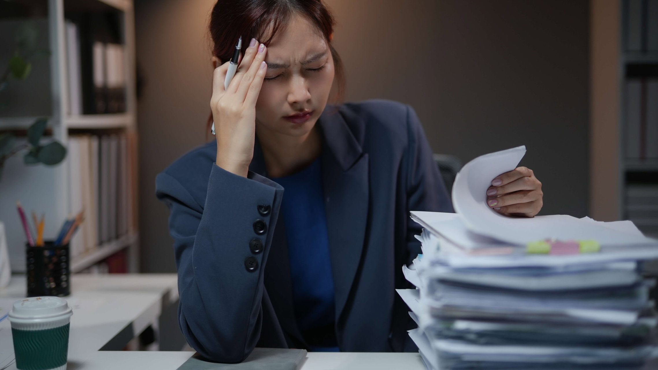 stressed businesswoman working late in office ove 2025 03 08 16 58 53 utc edited scaled